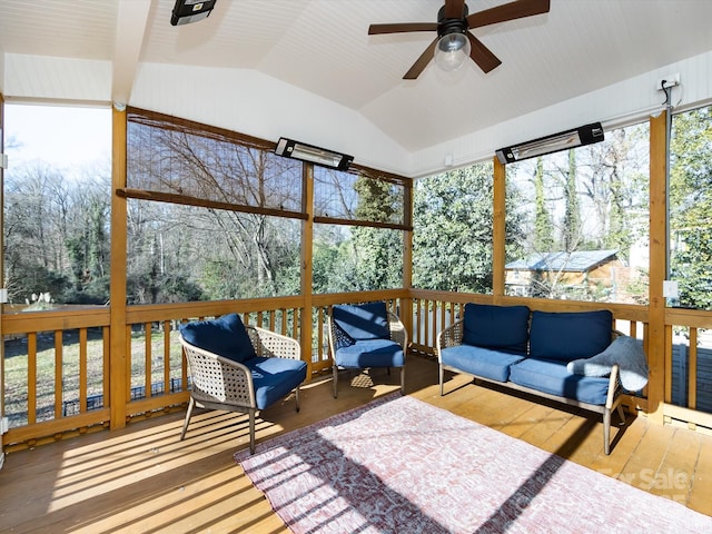 sunroom / solarium featuring ceiling fan and vaulted ceiling