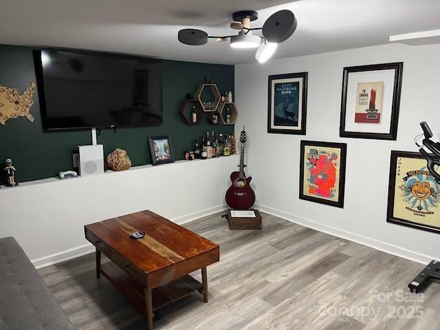 interior space featuring ceiling fan and wood-type flooring