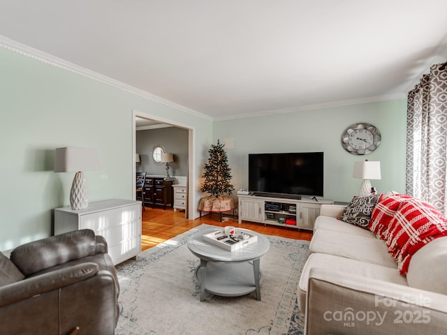 living room featuring crown molding and hardwood / wood-style flooring