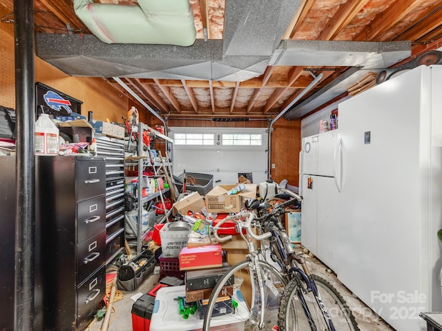 garage featuring white fridge