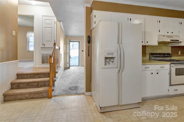 kitchen with stainless steel electric stove, white cabinetry, white refrigerator with ice dispenser, and ornamental molding