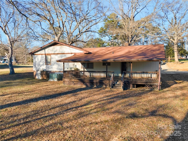 view of front of home with a front lawn and a deck