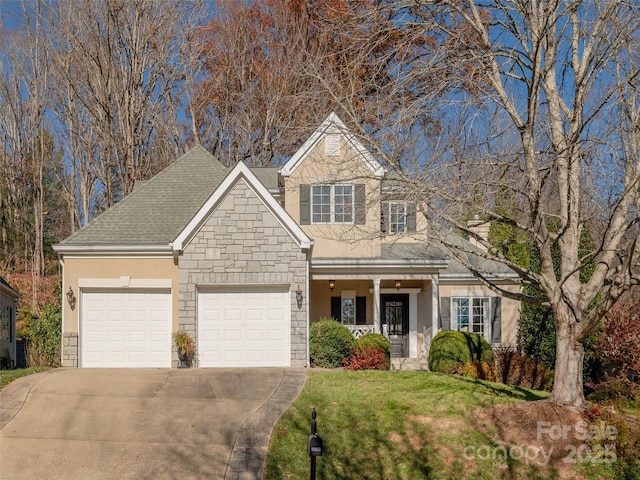 view of front of home with a garage and a front yard