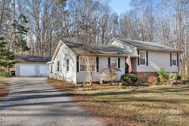 view of front of property featuring a garage and a front lawn