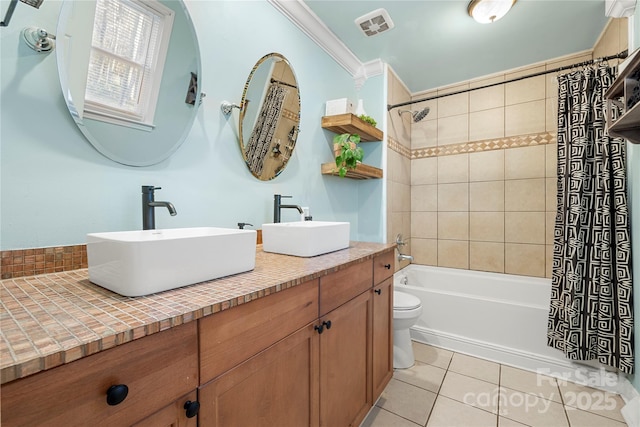 full bathroom with vanity, tile patterned flooring, toilet, ornamental molding, and shower / tub combo with curtain