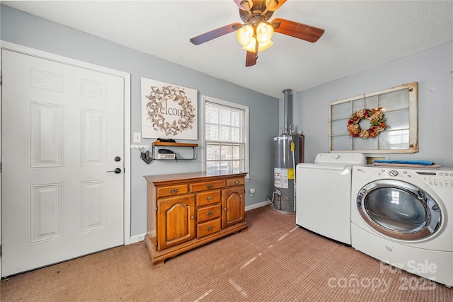 washroom featuring independent washer and dryer, a textured ceiling, light carpet, and water heater