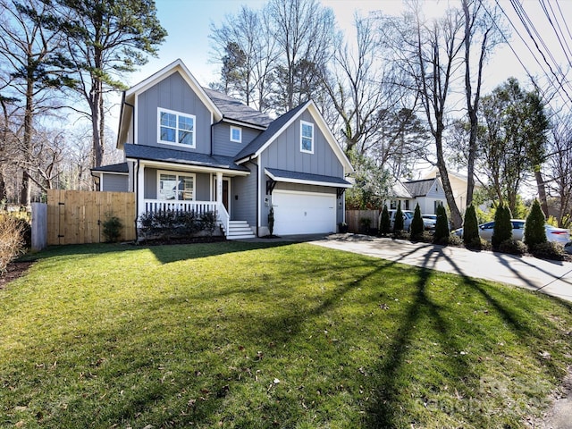 view of front facade with driveway, an attached garage, fence, a porch, and board and batten siding