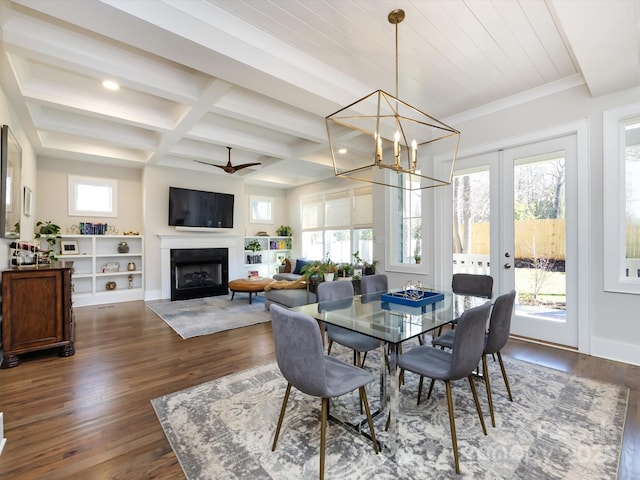 dining space with beam ceiling, dark wood finished floors, a fireplace, coffered ceiling, and baseboards