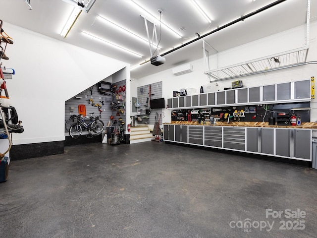 garage featuring a workshop area and a garage door opener