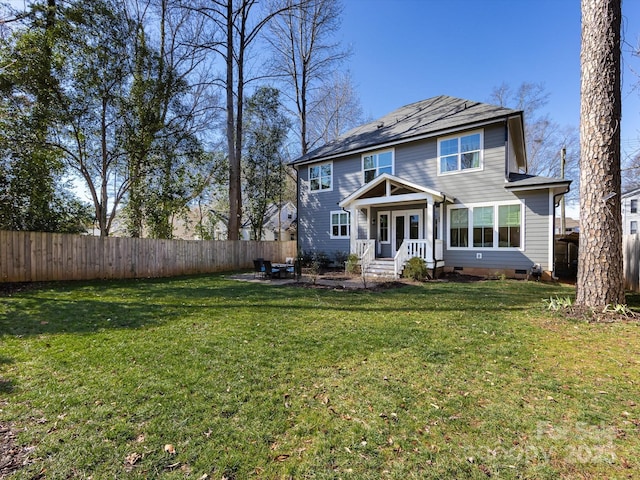 view of front of property with a front yard, crawl space, fence, and a patio