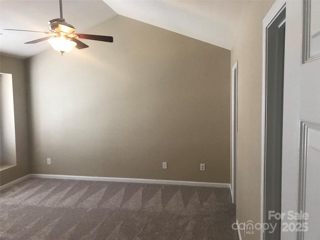 carpeted empty room with ceiling fan and lofted ceiling