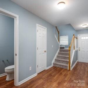 stairs with hardwood / wood-style flooring