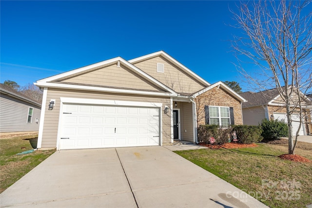 view of front of property featuring a garage and a front yard