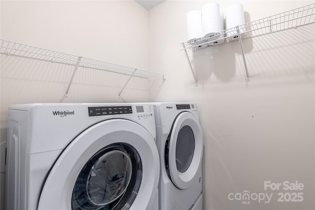 clothes washing area with independent washer and dryer