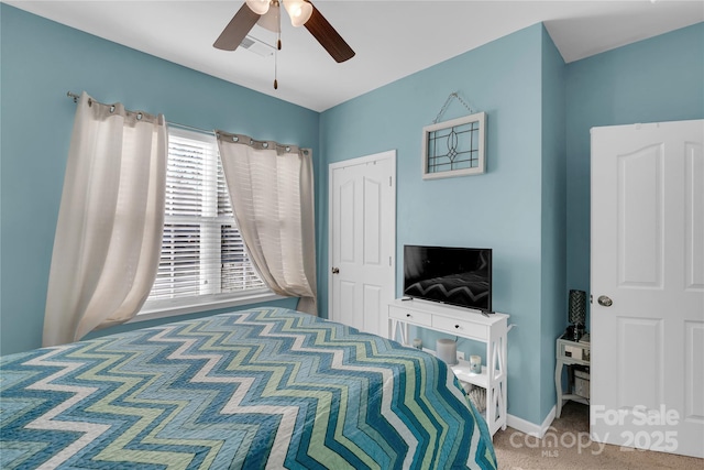 carpeted bedroom featuring ceiling fan