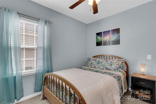 bedroom featuring light colored carpet and ceiling fan