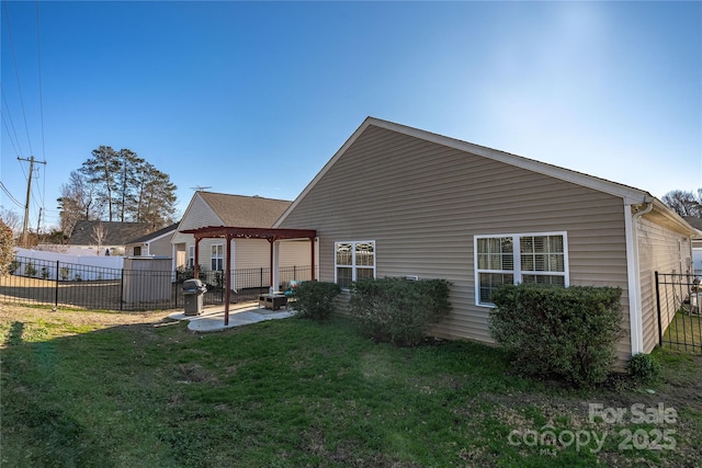 rear view of house featuring a lawn and a gazebo