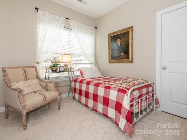 bedroom featuring light colored carpet