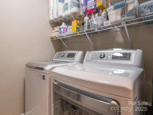 washroom with washing machine and dryer