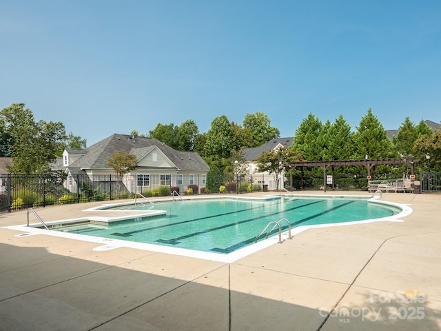 view of swimming pool with a pergola and a patio