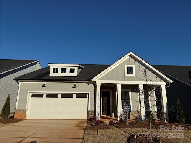 view of front of property featuring covered porch and a garage