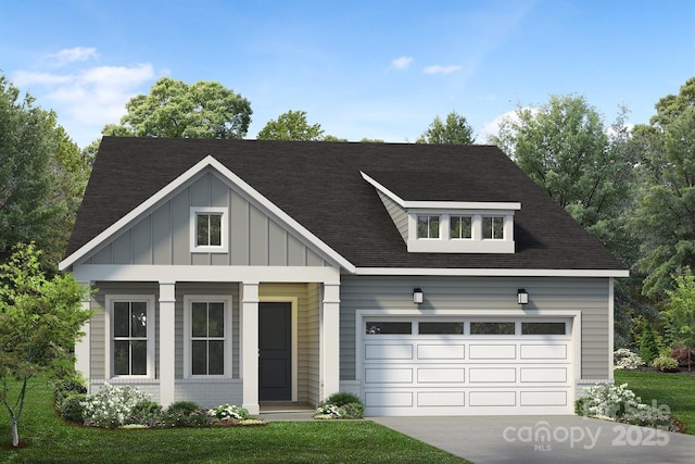 view of front of house with a garage and a front lawn