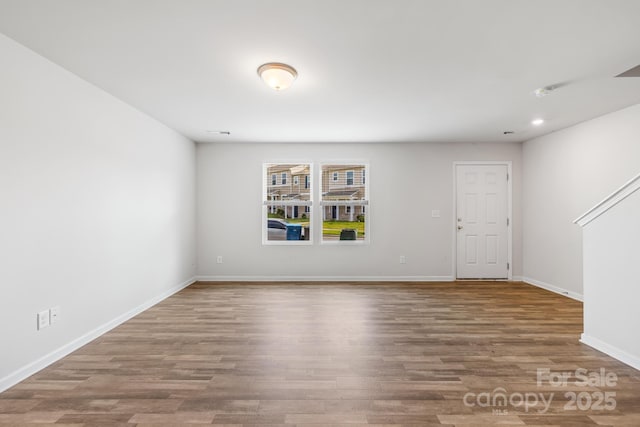 empty room with wood-type flooring