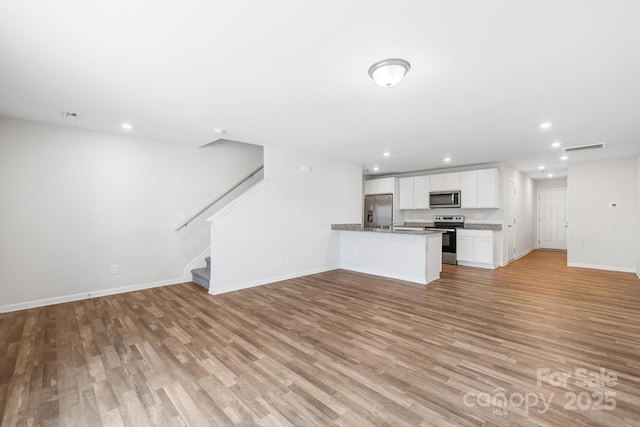 unfurnished living room featuring light wood-type flooring