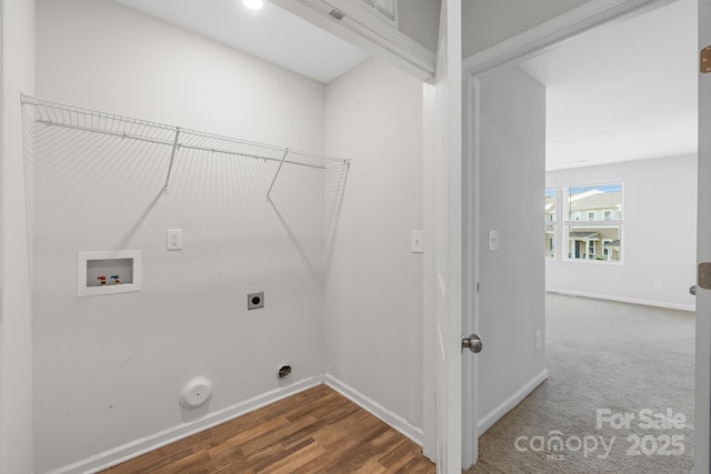 laundry room featuring electric dryer hookup, hookup for a gas dryer, hardwood / wood-style floors, and washer hookup