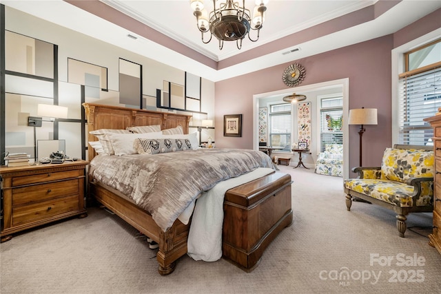 bedroom featuring ornamental molding, light colored carpet, a raised ceiling, and a notable chandelier