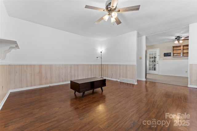 miscellaneous room with ceiling fan and dark hardwood / wood-style floors