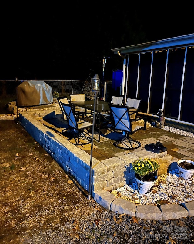 view of patio featuring a grill