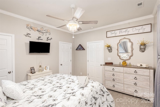 carpeted bedroom featuring ceiling fan and ornamental molding