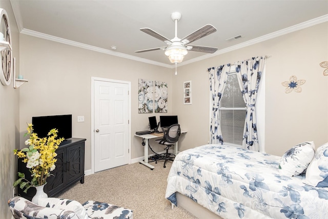 carpeted bedroom with ceiling fan and crown molding