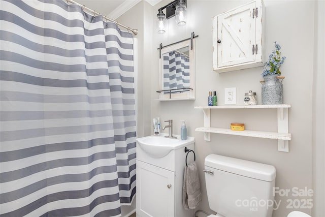 bathroom with toilet, ornamental molding, walk in shower, and vanity