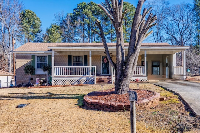 ranch-style home with a carport and covered porch