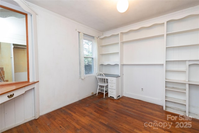 unfurnished office with dark hardwood / wood-style flooring and crown molding