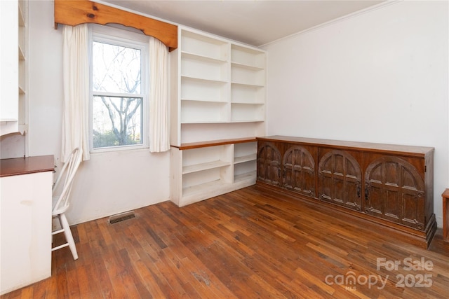 unfurnished bedroom featuring dark hardwood / wood-style flooring