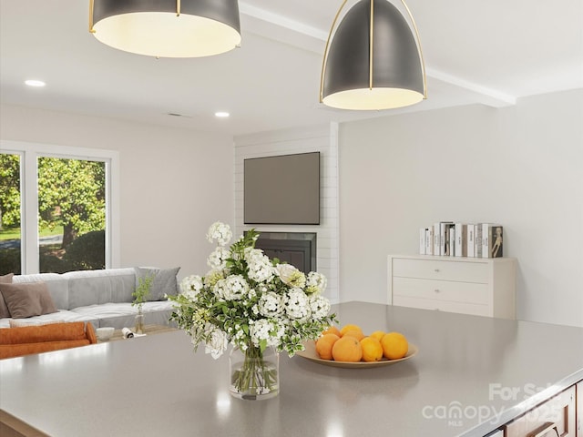 dining area featuring a large fireplace