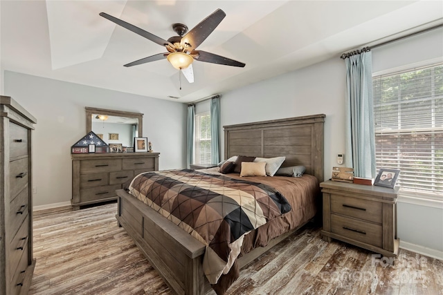 bedroom featuring hardwood / wood-style floors and ceiling fan