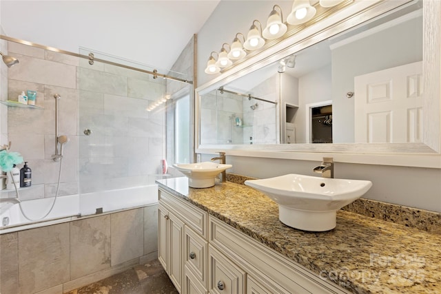 bathroom with vanity and shower / bath combination with glass door