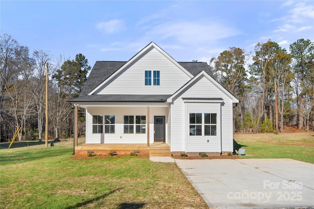 view of front of home with a front yard and a porch