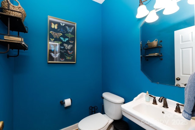 bathroom featuring sink and toilet