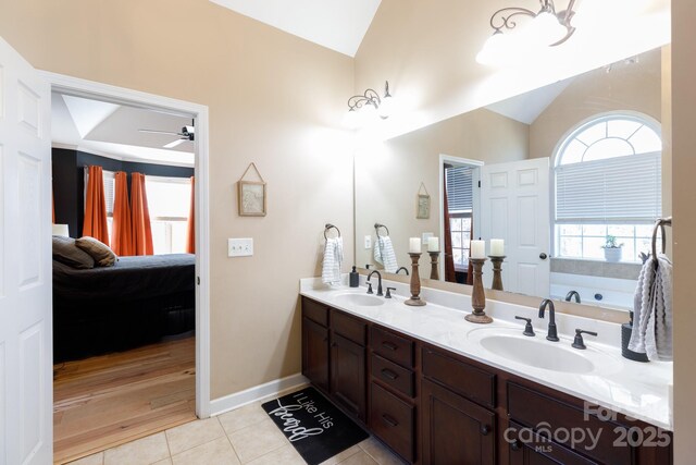 bathroom featuring a tub to relax in, ceiling fan, tile patterned flooring, and vanity