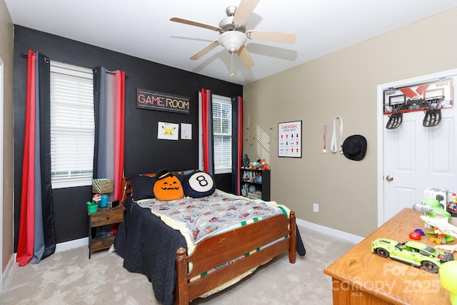 carpeted bedroom with ceiling fan