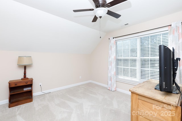 bonus room with light carpet, a healthy amount of sunlight, and vaulted ceiling