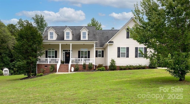 new england style home with covered porch and a front lawn