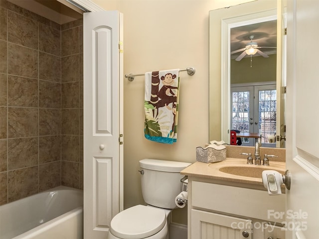 bathroom with toilet, french doors, and vanity