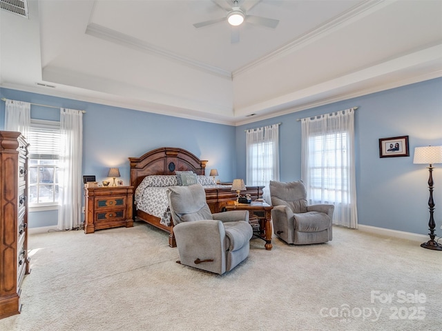 bedroom featuring a raised ceiling, ceiling fan, ornamental molding, carpet floors, and multiple windows