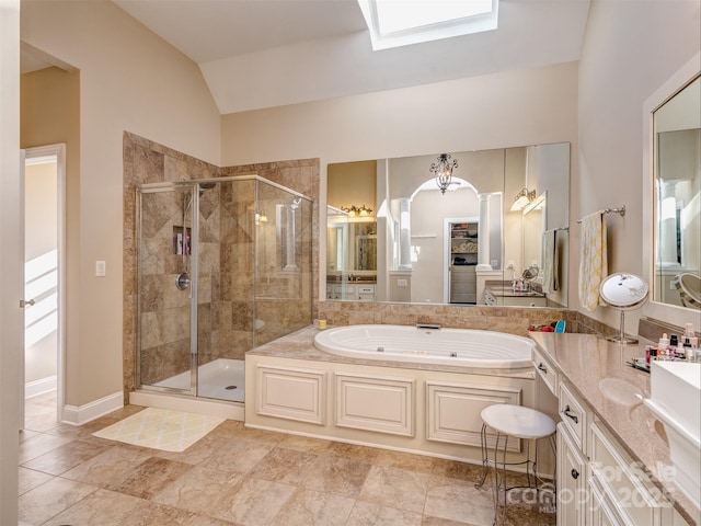 bathroom with vaulted ceiling, plus walk in shower, and vanity